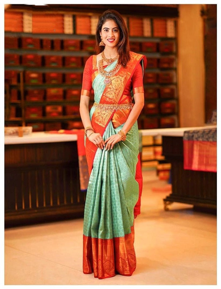 Pista_Orange Women Kanjivaram Zari Woven Banarasi Silk Saree with Unstitched Contrast Blouse Piece